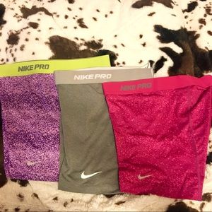 Three Nike Pro spandex shorts